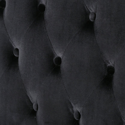 Canapé à oreilles hautes capitonné en velours noir